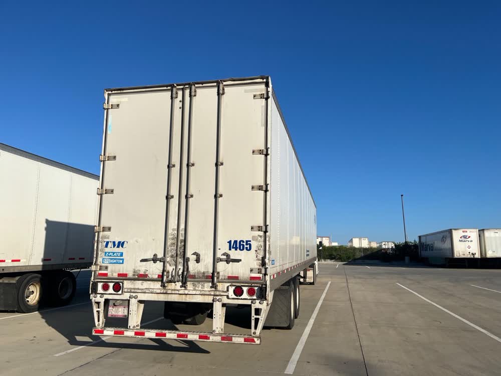 Trailers parked in striped concrete spots